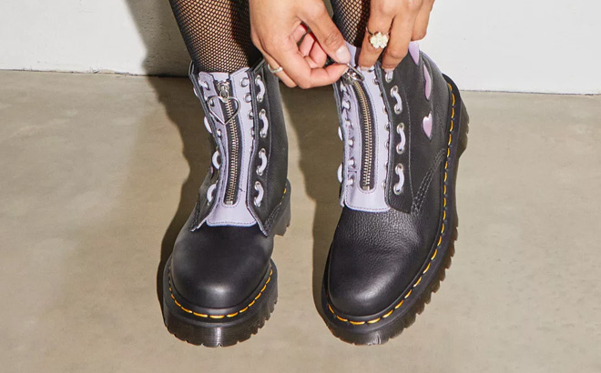 A Person Wearing Dr Martens 1460 Zip Heart Virginia Satin Lux Lace Up Boots A Person Wearing Dr Martens 1460 Zip Heart Virginia Satin Lux Lace Up Boots