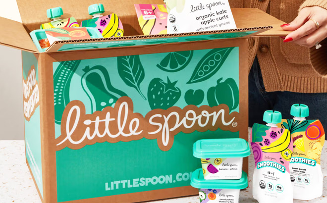 A Woman Opening a Little Spoon Delivery Box
