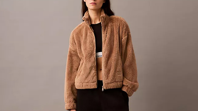 A person wearing a Calvin Klein Womens Sherpa Jacket