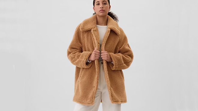 A person wearing a GAP Womens Sherpa Coat A person wearing a GAP Womens Sherpa Coat
