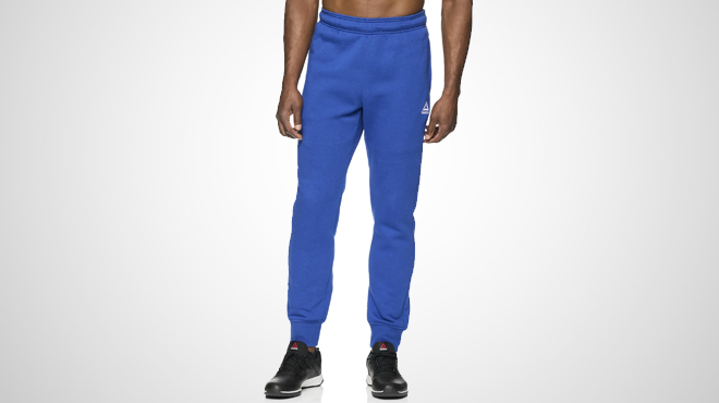 A person wearing a Reebok Mens Delta Joggers
