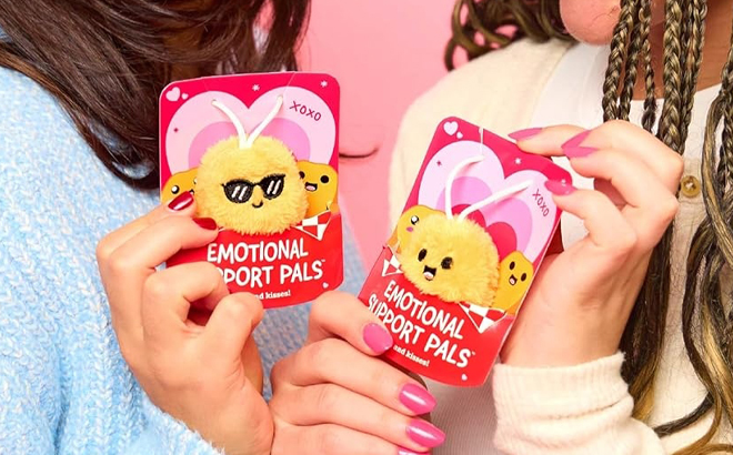 Hands holding Emotional Support Valentines Day Plush Nuggets