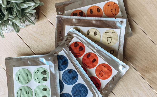 Non Toxic Essential Oil Bug Repelling Stickers on a Table Non Toxic Essential Oil Bug Repelling Stickers on a Table