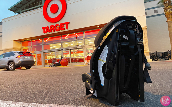 A Baby Car Seat on The Parking Lot Floor in Front of Target
