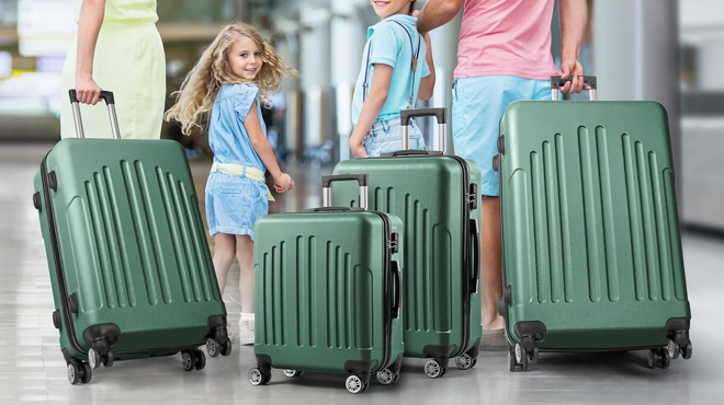 A Family Using the Zimtown 4 Piece Hard Shell Luggage Set in Vintage Green