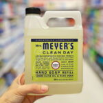 A Person Holding Mrs Meyers Liquid Hand Soap Refill in Lemon Verbena Scent