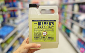 A Person Holding Mrs Meyers Liquid Hand Soap Refill in Lemon Verbena Scent