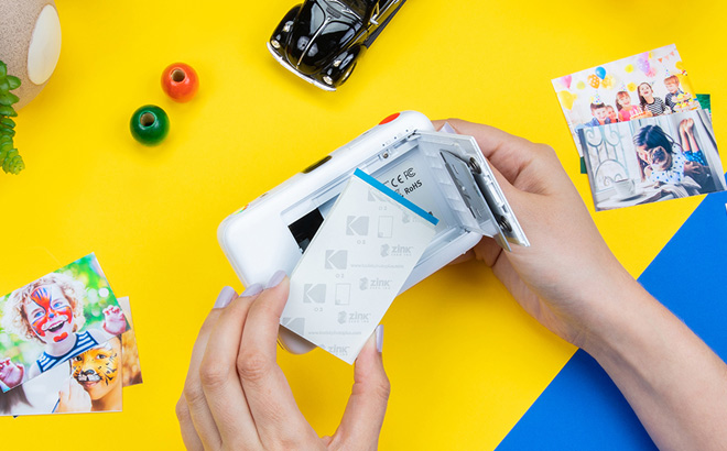 A Person Holding a Kodak Step Instant Print Camera A Person Holding a Kodak Step Instant Print Camera