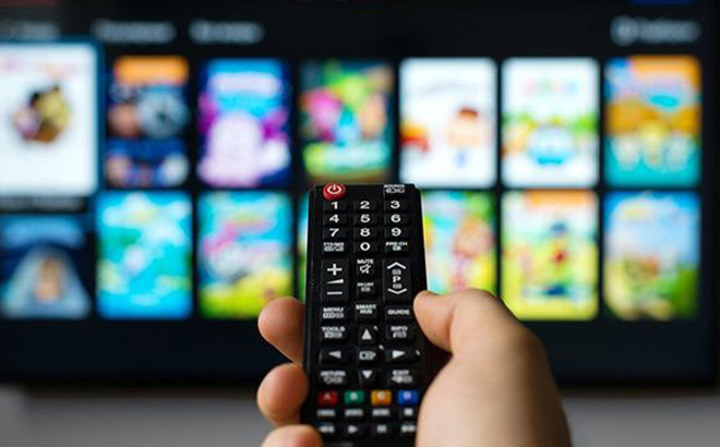 A Person Holding a Remote A Person Holding a Remote