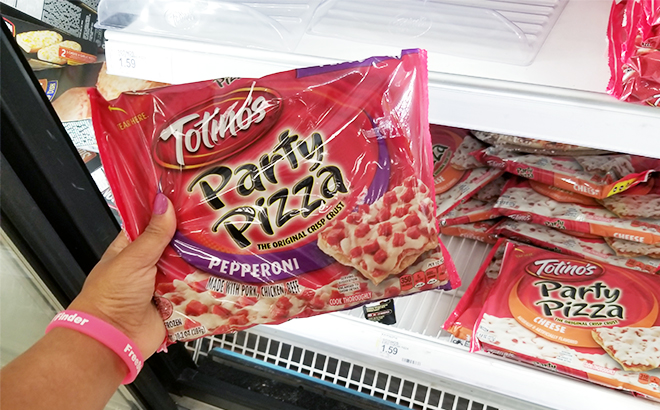 A Person Holding the Totinos Pepperoni Party Frozen Pizza at Target