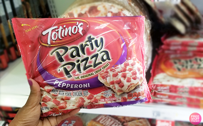 A Person Holding the Totinos Pepperoni Party Frozen Pizza