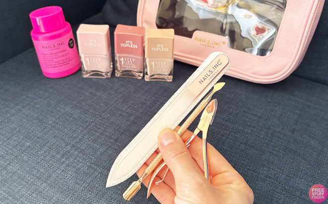 A Woman Showing Nails Inc Nail Tools That Are Part of Their 7pc Manicure Set