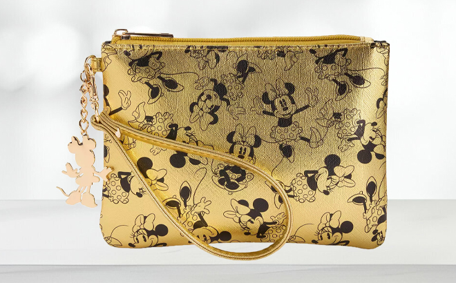 Disney Minnie Mouse Gold Metallic Wristlet on a Table