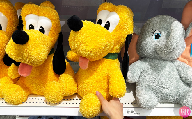 Disney Weighted Plush Pluto on Store Shelf Disney Weighted Plush Pluto on Store Shelf