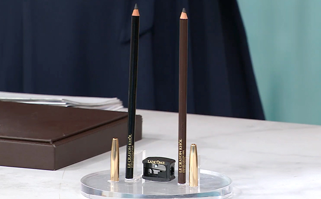 Lancome Le Crayon Khol Pencil 2 Pack and Sharpener on a Product Stand