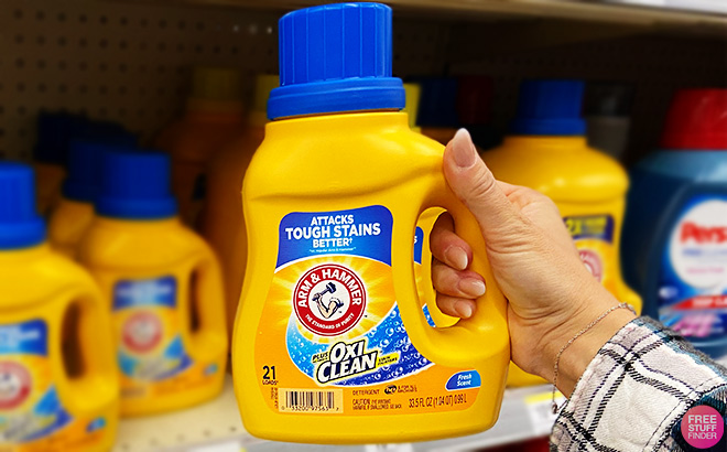 A Person Holding Arm Hammer Oxi Clean Stain Fighters Detergent A Person Holding Arm Hammer Oxi Clean Stain Fighters Detergent