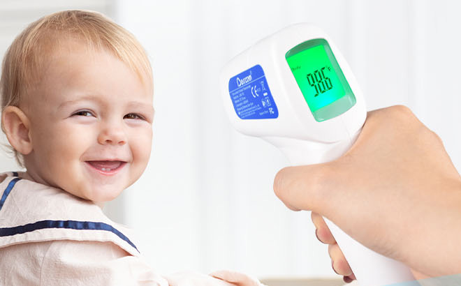 A Person Holding Berrcom Non Contact Forehead Thermometer