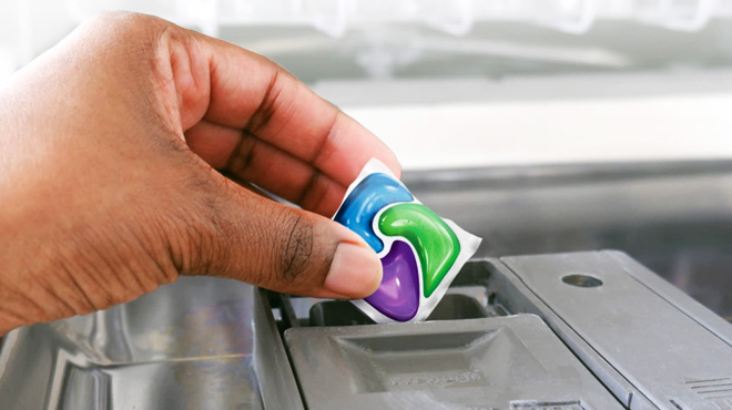 A Person Holding a Cascade Platinum Plus Dishwasher Pod A Person Holding a Cascade Platinum Plus Dishwasher Pod