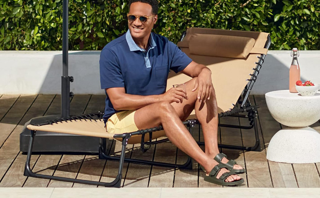 A Person Sitting on a Best Choice Products Patio Chaise Lounge Chair A Person Sitting on a Best Choice Products Patio Chaise Lounge Chair