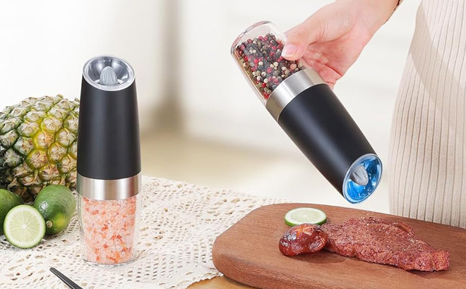 A Person Using Electric Pepper and Salt Grinder