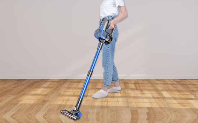 A Woman Cleaning with the EIOEIR Cordless Stick Vacuum Cleaner