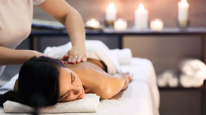 A Woman Getting a Body Scrub at Forever Young Spa