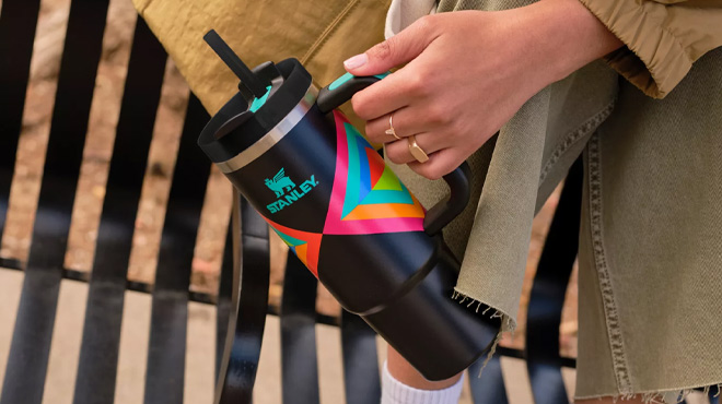 A Woman Holding Stanley 30-Ounce Quencher H2.0 FlowState Tumbler in Hyper Geo A Woman Holding Stanley 30-Ounce Quencher H2.0 FlowState Tumbler in Hyper Geo
