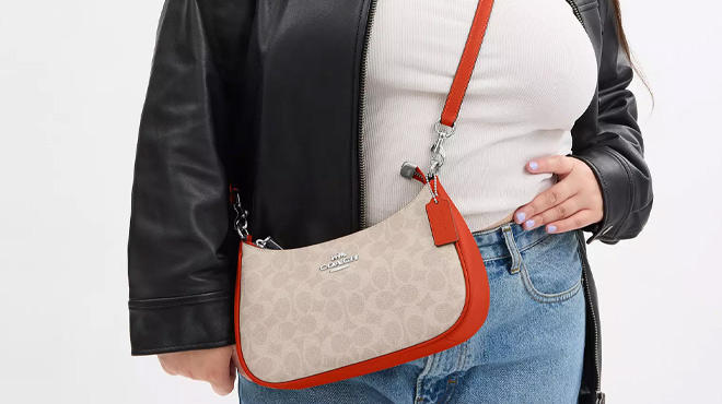 A Woman Wearing Coach Outlet Teri Shoulder Bag In Signature Canvas