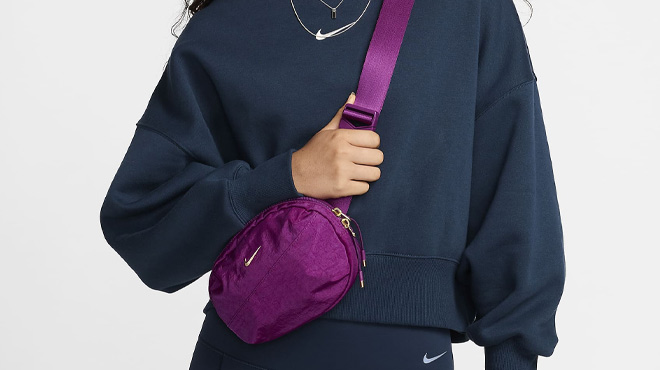 A Woman Wearing Nike Aura Crossbody Bag