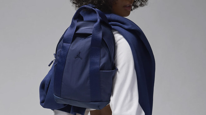 A Woman Wearing Nike Jordan Alpha Mini Backpack