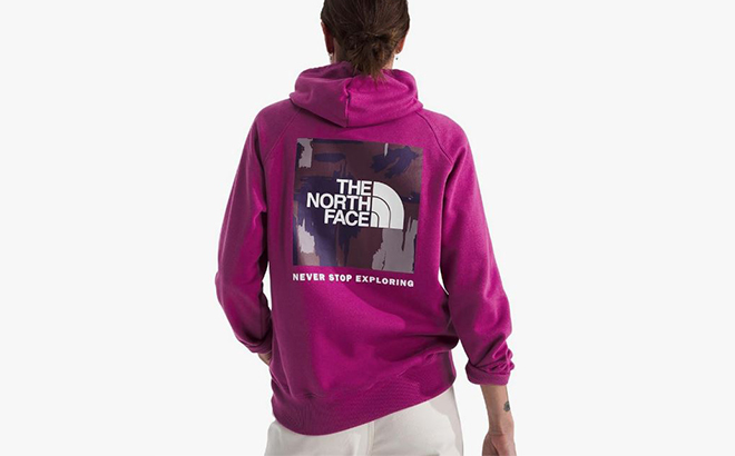 A Woman Wearing The North Face Box NSE Hoodie