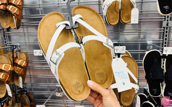 Hand holding Time and Tru Womens Flat Footbed Sandals 1