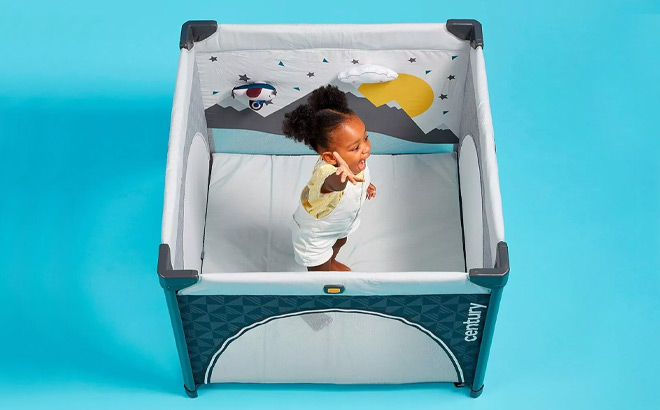 Kid Playing in a Century Play On 2 in 1 Playard