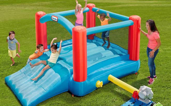 People playing in a Little Tikes Pack n Roll Bounce House
