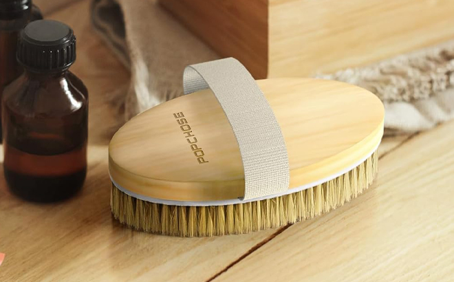 Popchose Exfoliating Body Brush on a Table
