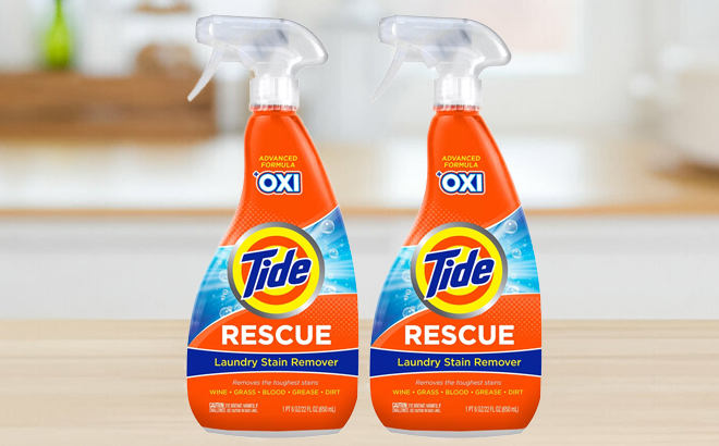 Two Tide Stain Remover Spray Bottles on a Table