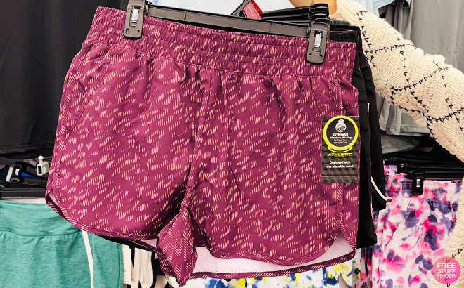a Person Holding Plum Athletic Works Womens and Womens Plus Running Shorts