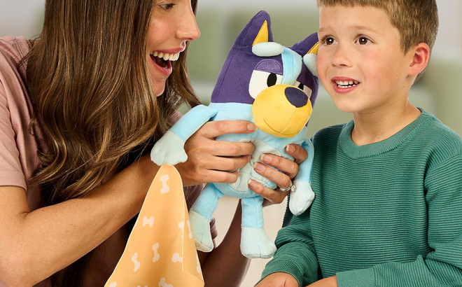 A Mother and a Child Playing with a Bluey Plush A Mother and a Child Playing with a Bluey Plush