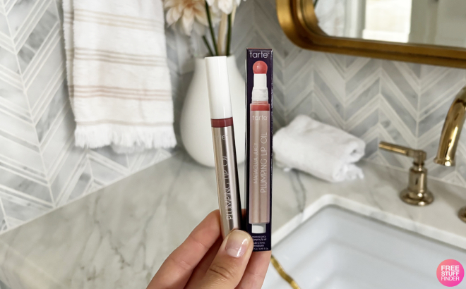 A Person Holding Tarte Maracuja Juicy Lip Plumping Oil