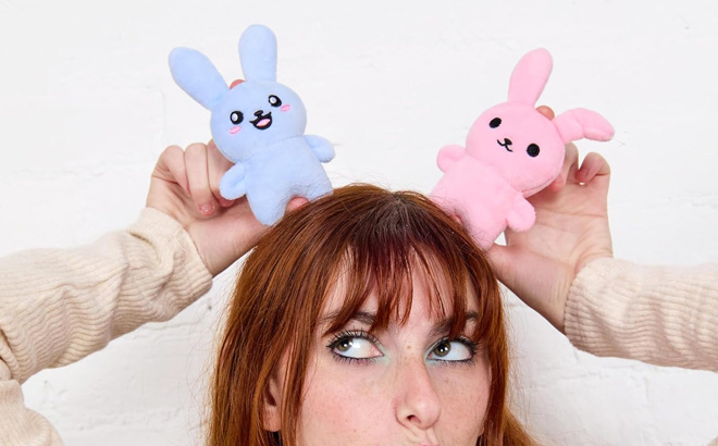 A Person Playing with Emotional Support Bunnies A Person Playing with Emotional Support Bunnies
