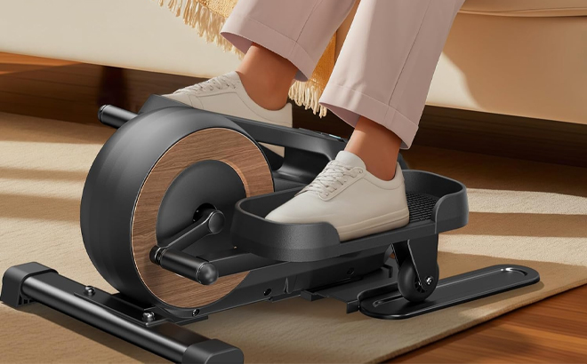 A Person Using the Merach Under Desk Elliptical Machine