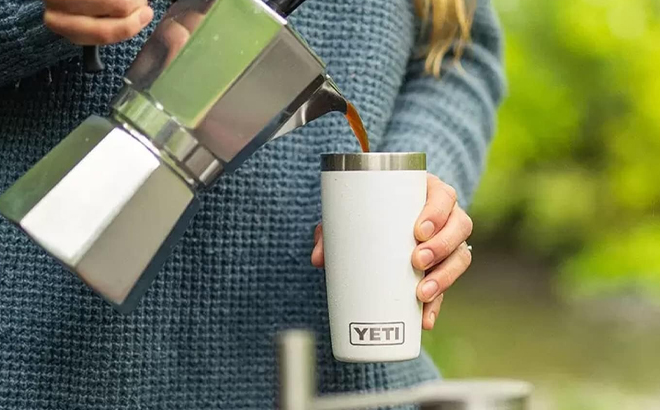 A Person pouring Coffee into YETI Rambler 10 Ounce Tumbler