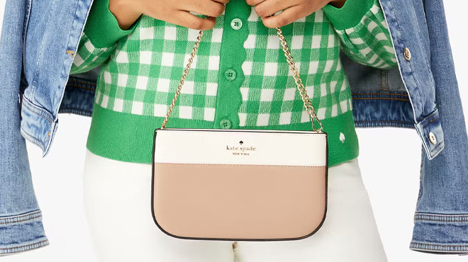 A Woman Holding Kate Spade Madison Lilly Pochette Bag