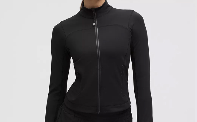 A Woman Wearing Lululemon Lightweight Running Jacket in Black A Woman Wearing Lululemon Lightweight Running Jacket in Black