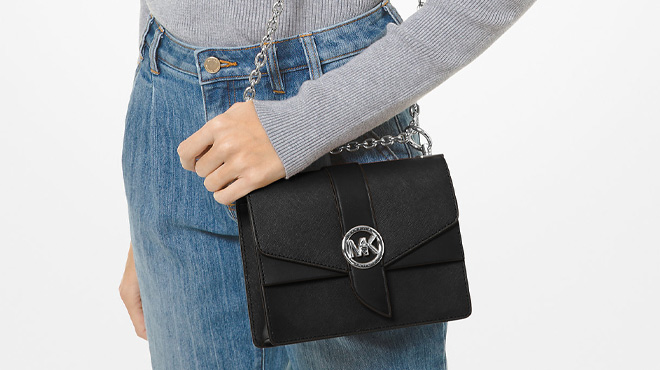 A Woman Wearing Michael Kors Greenwich Small Saffiano Leather Crossbody Bag in Black