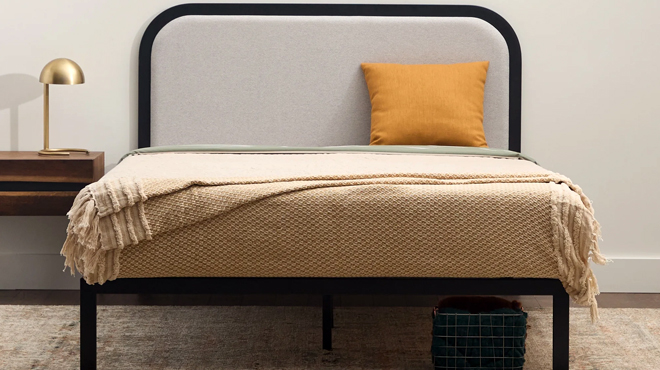 Rest Haven Metal Platform Bed Queen size with a chic rounded upholstered headboard Rest Haven Metal Platform Bed Queen size with a chic rounded upholstered headboard