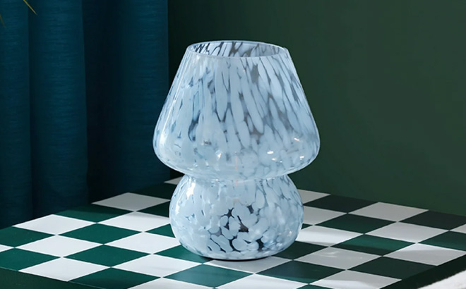 Urban Shop Blue Tortoise Glass Battery Powered Mushroom Table Lamp on the Green Table Urban Shop Blue Tortoise Glass Battery Powered Mushroom Table Lamp on the Green Table