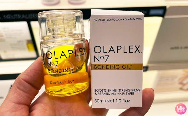 a Person Holding Olaplex No 7 Bonding Oil a Person Holding Olaplex No 7 Bonding Oil