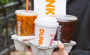 A Person Carrying a Dunkin Drinks Takeout