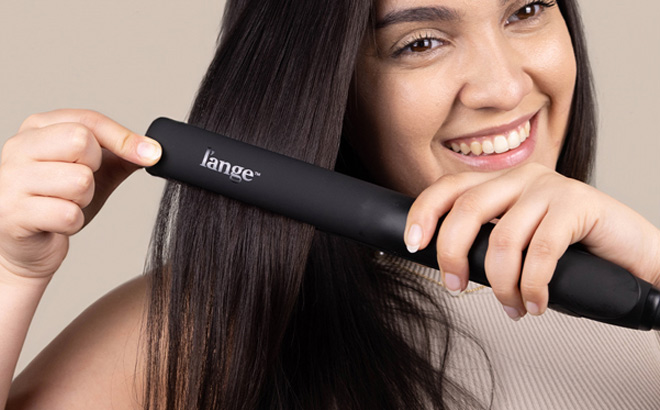 A Person Holding Lange Hair Flat Iron Hair Straightener